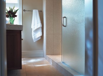 a frosted glass window on a walk in shower