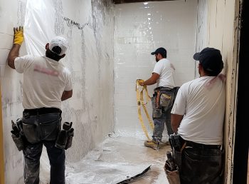 workers doing a bathroom remodel